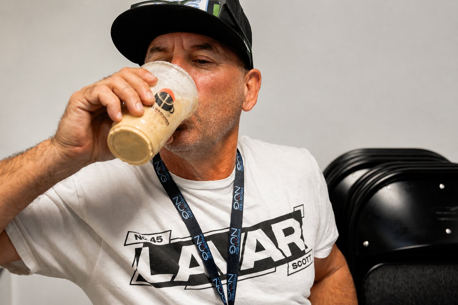 Iced coffee with cream in a branded High Grounds cup