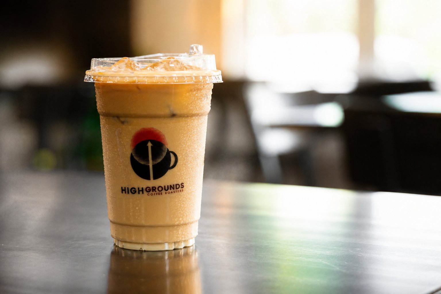 Iced latte in a High Grounds cup